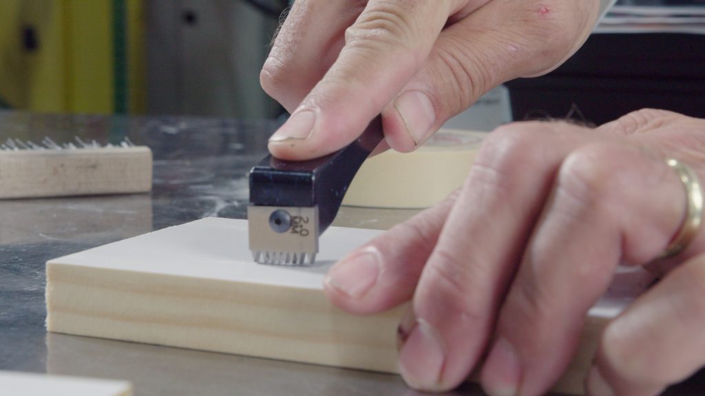 Cross hatch cutter on a white coated board